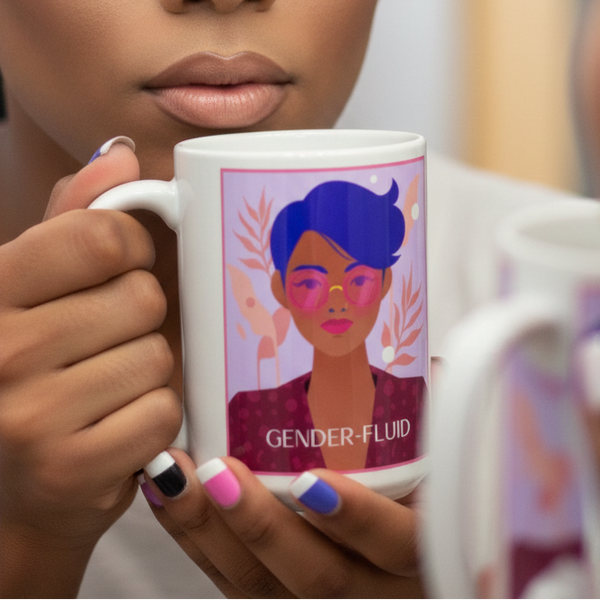 A person holds a Gender-fluid Mug featuring a vivid illustration of a blue-haired individual with pink glasses, embodying LGBTQIA+ pride. The mug is a vibrant symbol of self-expression and empowerment.