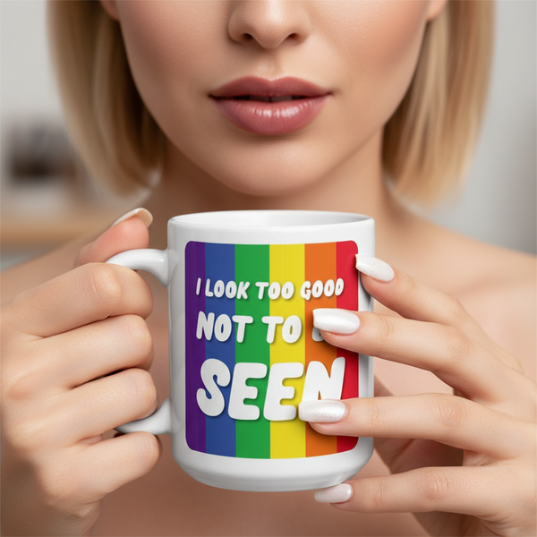 Close-up of hands holding the I Look Too Good Mug, adorned with vibrant rainbow stripes and empowering slogan. Perfect for showcasing pride and self-expression with every sip.