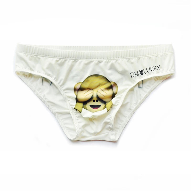 Front-facing white brief with a cartoon monkey covering its eyes and a DM LUCKY logo