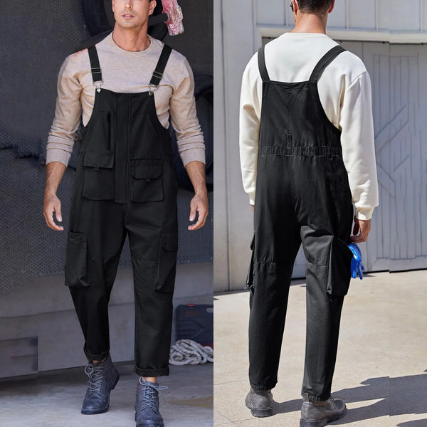 Front and back views of a model wearing black utility bib overalls with multiple pockets