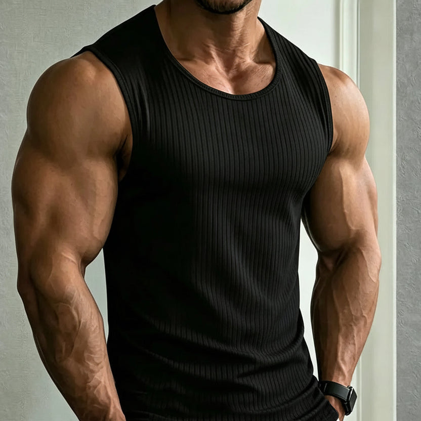 Front view of a muscular model wearing a black ribbed sleeveless tank top