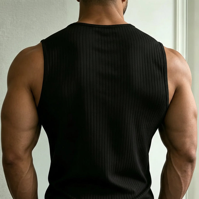 Rear view of a muscular model wearing a black ribbed sleeveless tank top