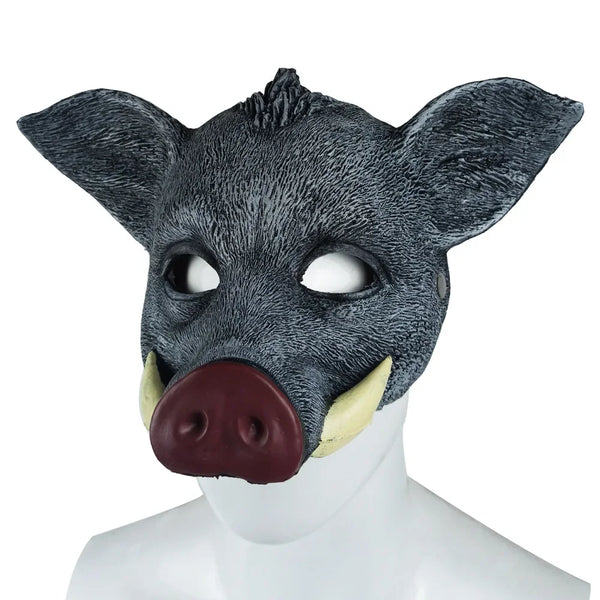 Front-facing black wild boar mask with large ears, tusks, and a dark brown snout on a mannequin