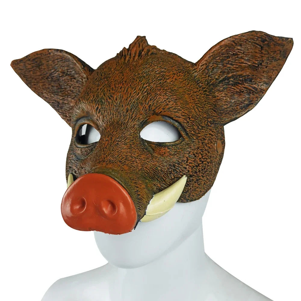 Front three-quarter view of a brown boar mask with large ears, tusks, and red snout
