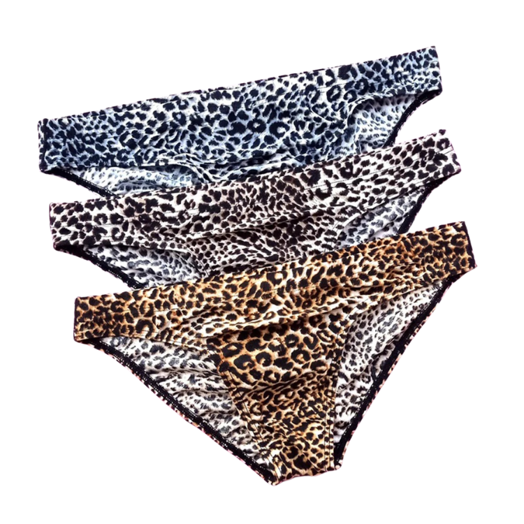 Three leopard-print men's briefs layered diagonally, in blue-gray, brown, and tan