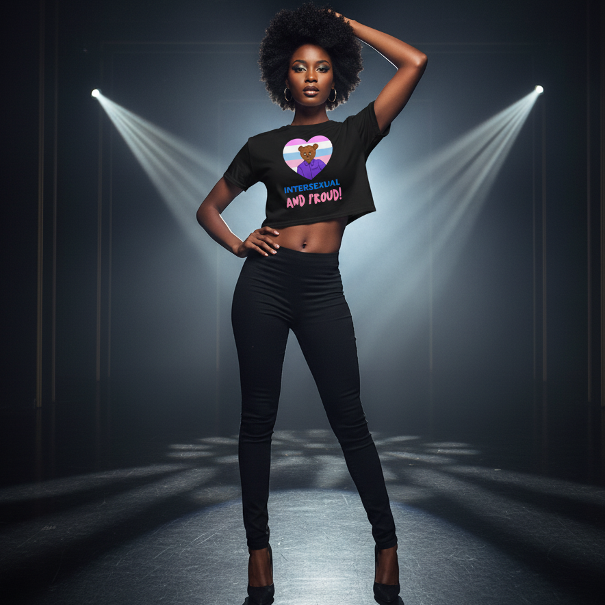 Intersexual And Proud Crop Top with a pride heart, styled on a bold woman in black heels and pants, spotlighted by dramatic beams.
