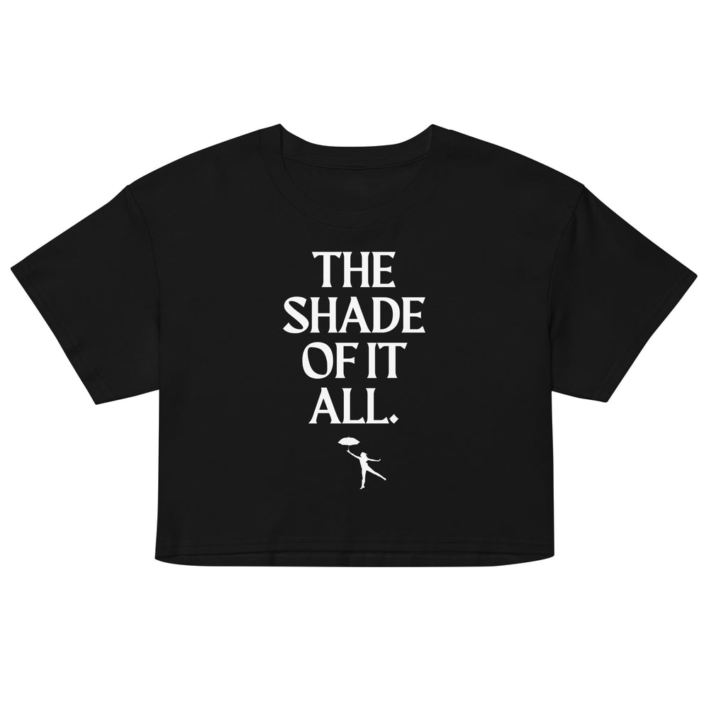 Front-facing black cropped T-shirt with white “THE SHADE OF IT ALL.” lettering and umbrella figure
