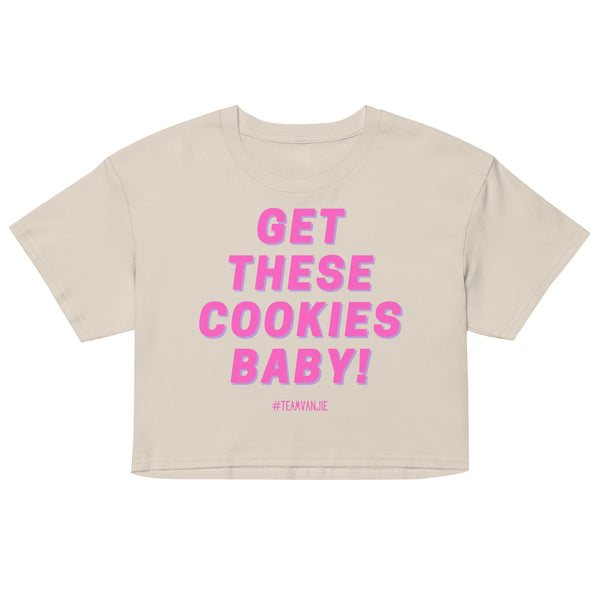 Front view of a cream crop top reading “GET THESE COOKIES BABY!” in pink