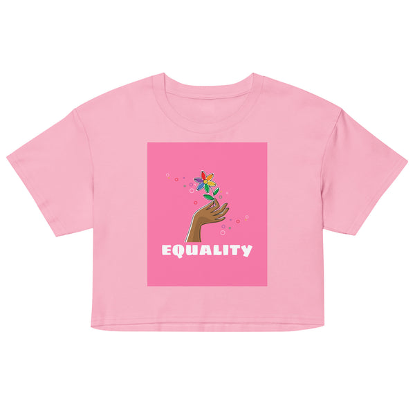 Front view of a pink crop top with a hand holding a flower above the word “EQUALITY”