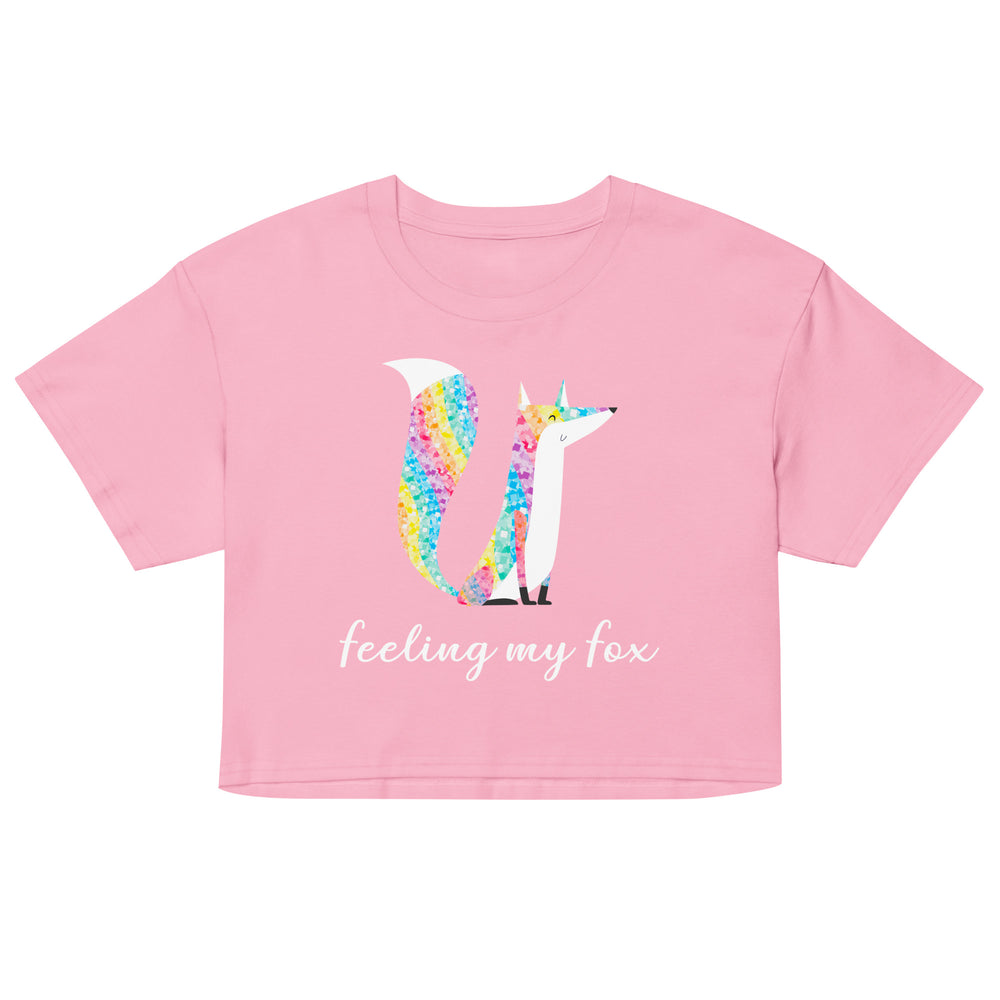 Front view of a pink crop top with a colorful fox graphic and “feeling my fox” text