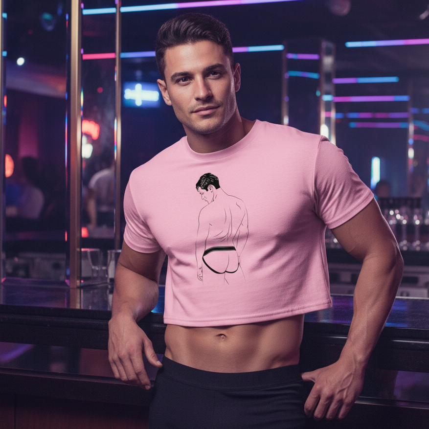 A man in a nightclub wears the Jockstrap Crop Top, a pink, playful design celebrating queer identity, featuring a line drawing of a man's back.