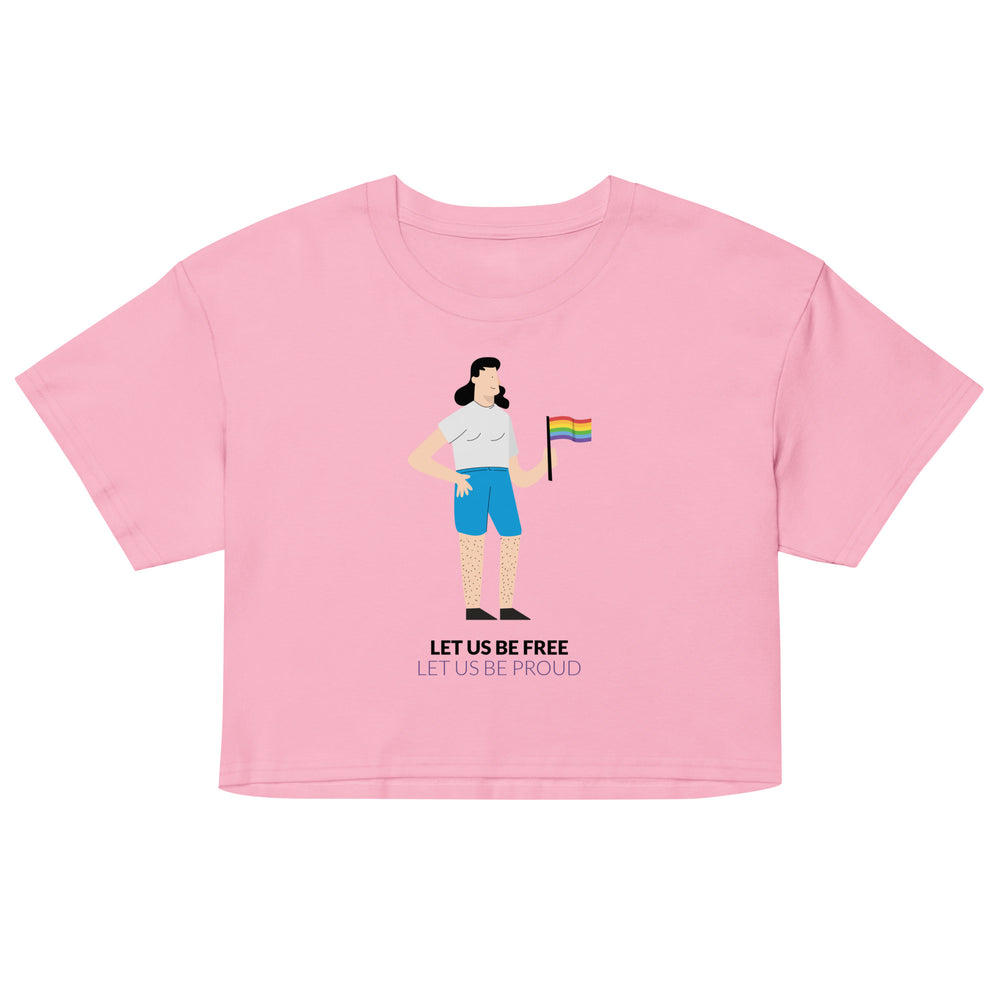 Front view of a pink gay crop top with a person holding a rainbow flag and “LET US BE FREE LET US BE PROUD” text