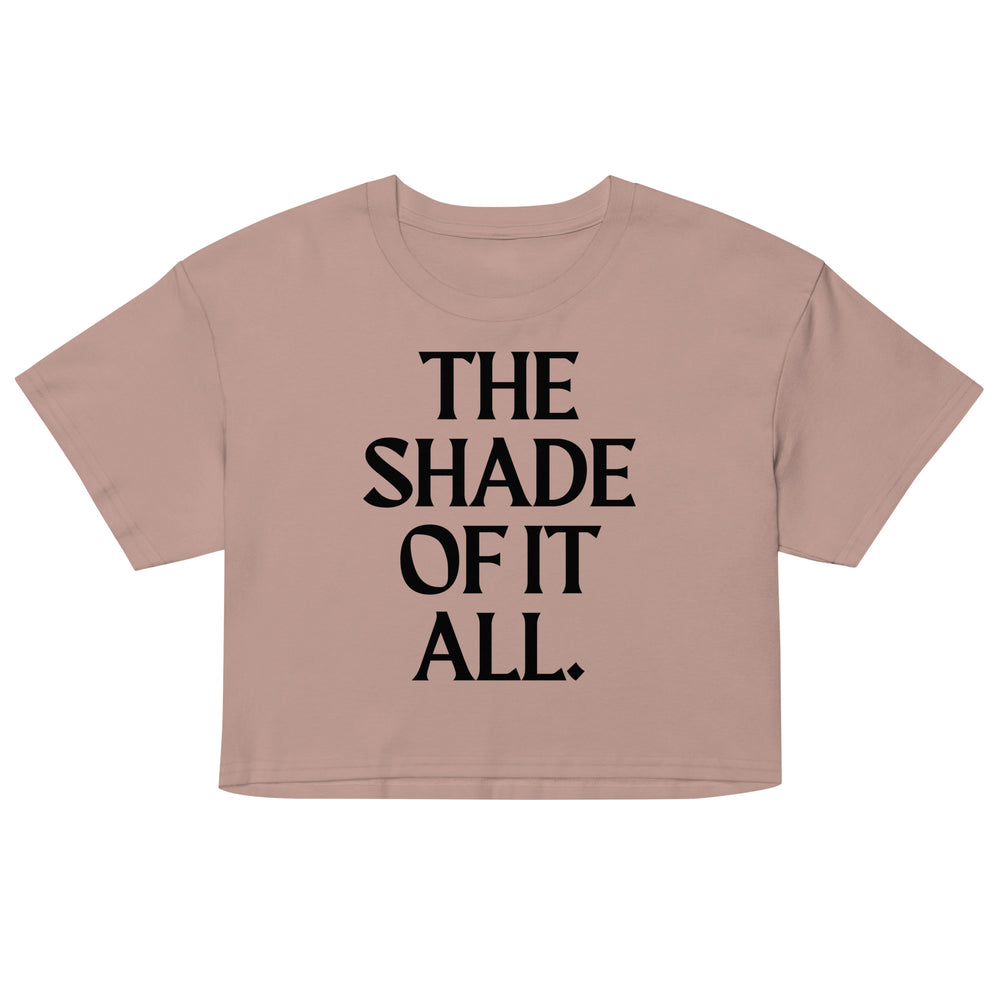 Front-view mauve crop top with bold black text reading “THE SHADE OF IT ALL.”