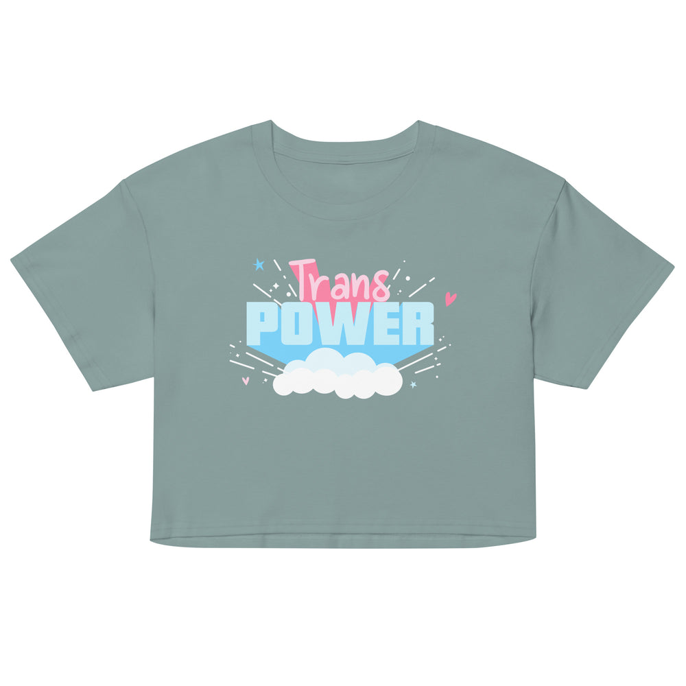 Front view of a sage green crop top reading “Trans POWER” above clouds