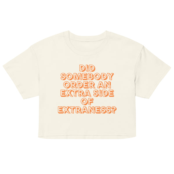 Front-facing cream crop top with orange text reading “DID SOMEBODY ORDER AN EXTRA SIDE OF EXTRANESS?”
