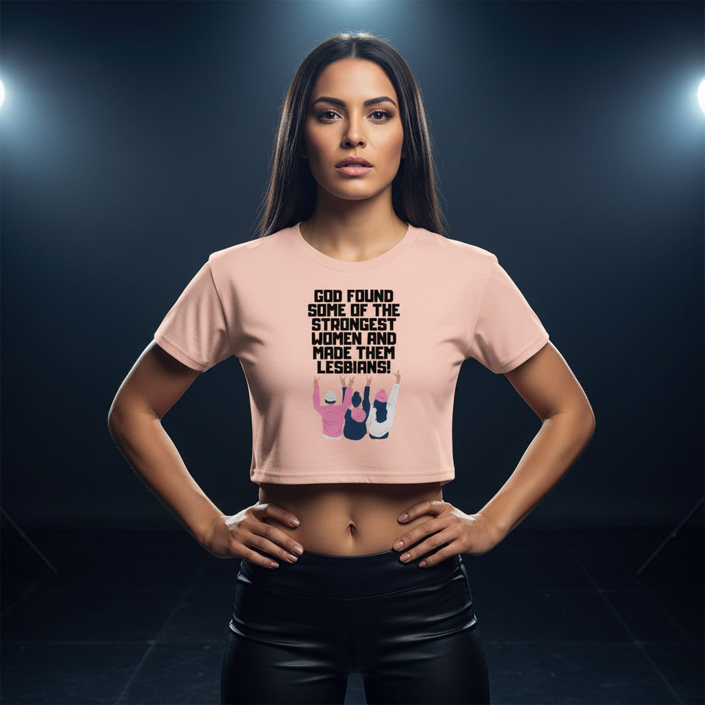 Pink crop top with "God found some of the strongest women and made them lesbians!" and raised fists in diverse skin tones.