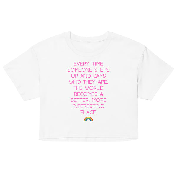 Front view of a white crop top with pink text and a small rainbow graphic
