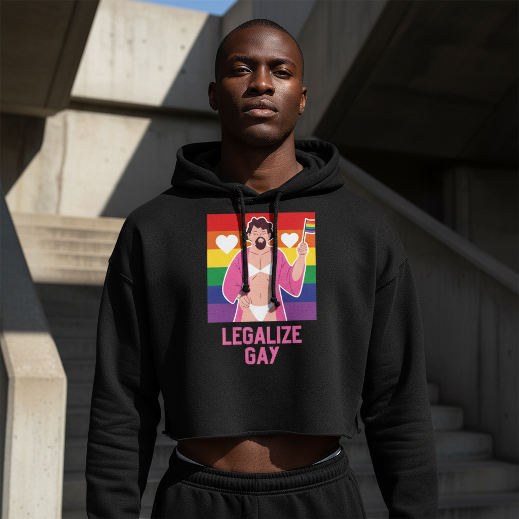 Crop hoodie with bold pink "LEGALIZE GAY" text, cartoon waving a rainbow flag, hearts, and a bright rainbow backdrop; stairs behind.
