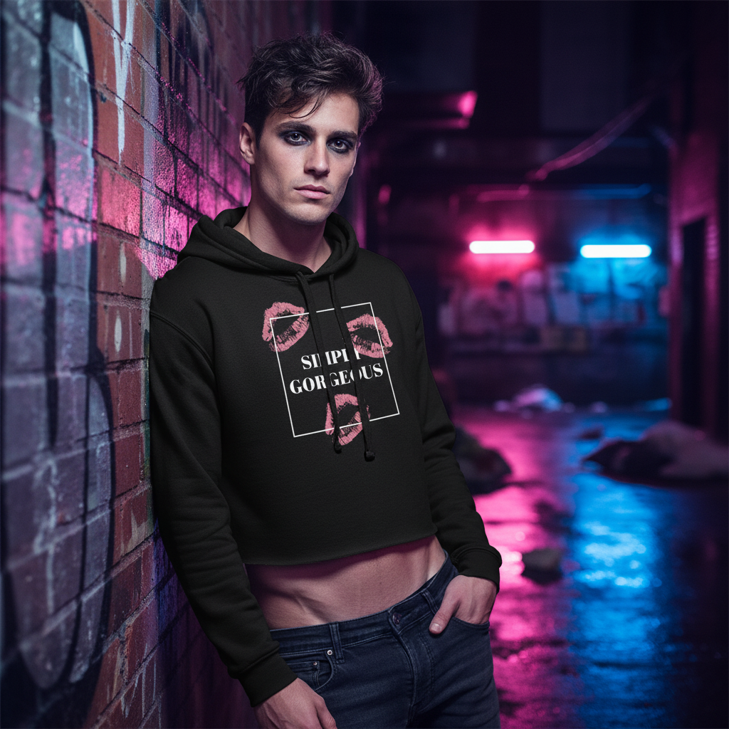 Simply Gorgeous Crop Hoodie with pink lipstick prints and "SUPER GORGEOUS" text, worn by a femme guy against neon-lit graffiti.
