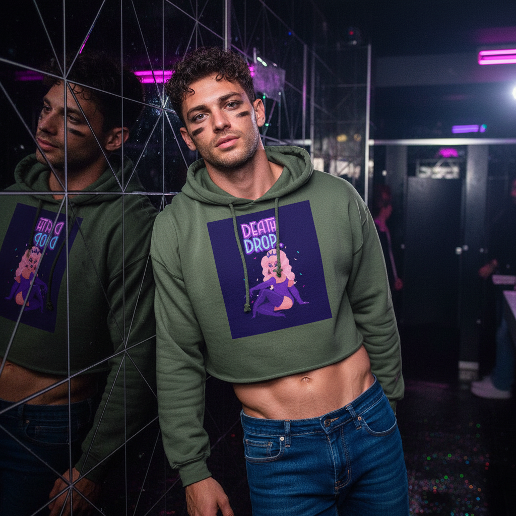 Death Drop Crop Hoodie on a curly-haired guy with face paint, midriff bared, neon purple and pink club lights reflecting around him.
