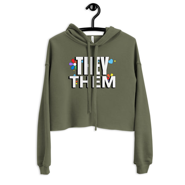 Cropped olive-green They / Them Crop Hoodie with bold white text and colorful graphics, symbolizing LGBTQIA+ pride and self-expression, embodying empowerment and visibility.