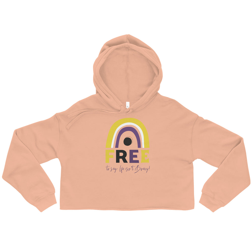Front view of a peach cropped hoodie with a rainbow arch and “FREE” graphic reading “to say: life isn’t Binary!”