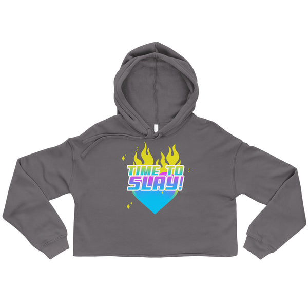 Charcoal-gray Time To Slay! Crop Hoodie featuring a vibrant blue heart with yellow flames and bold pastel text, symbolizing queer empowerment and joyful self-expression.