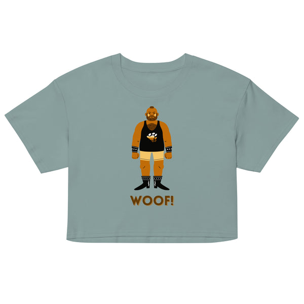 Front view of a pale blue crop top with a bear illustration and “WOOF!” text