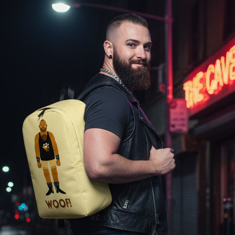 Yellow Woof! Gay Bear Minimalist Backpack with “WOOF!”, paw prints, cartoon wrestler; carried by bearded man in leather vest.
