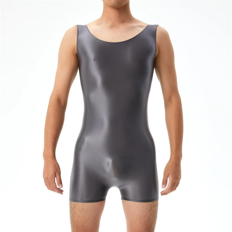 Front view of a person wearing a sleeveless metallic gray wrestling bodysuit