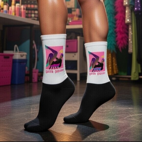 Crew-length Yass Queen Socks in black and white, bold stylized figure art, and "QUEEN ENERGY" slogan
