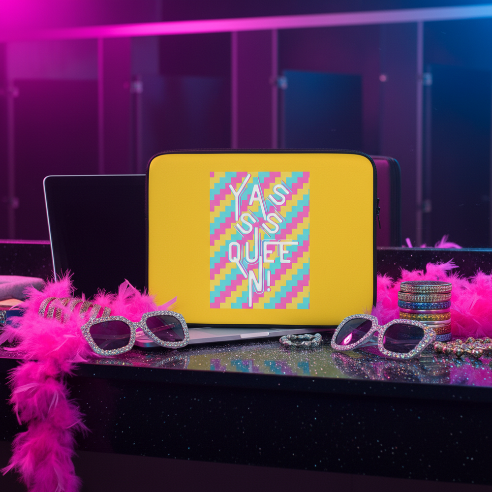 Laptop sleeve with bold yellow checkered neoprene, “I AM AN ICON QUEEN”; shown with sparkly sunglasses, beads, pink boa