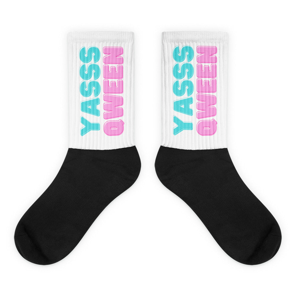 Crew-length Yasss Qween Socks: Black foot and white leg with “YASS QUEEN” in light blue and pink