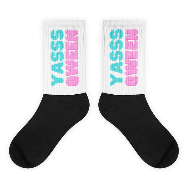 Crew-length Yasss Qween Socks: Black foot and white leg with “YASS QUEEN” in light blue and pink