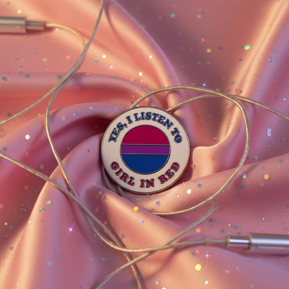 Enamel pin reading “Yes, I Listen to Girl in Red” with bisexual pride colors