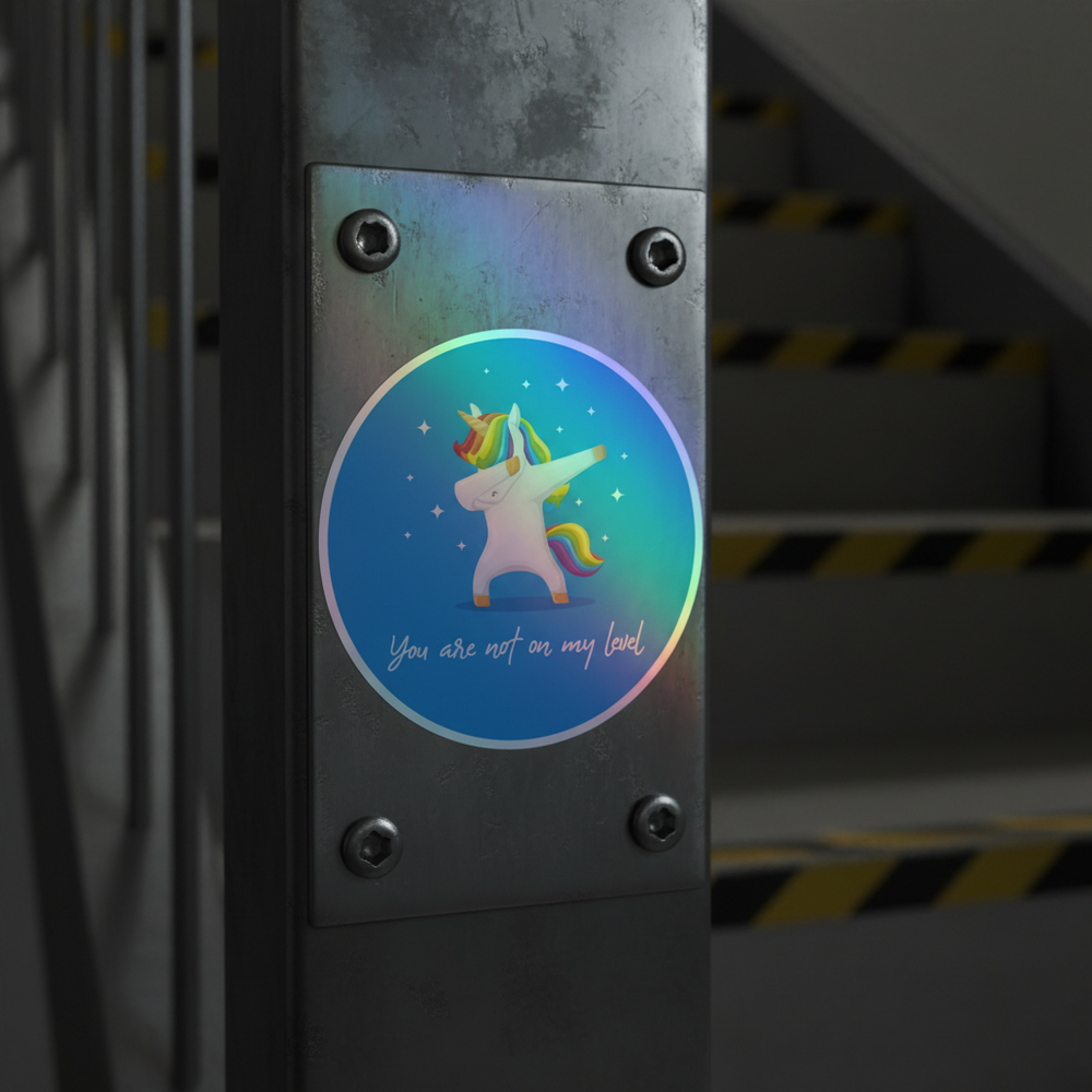 Round holographic sticker of a rainbow-maned unicorn dabbing, reading “You are not on my level”