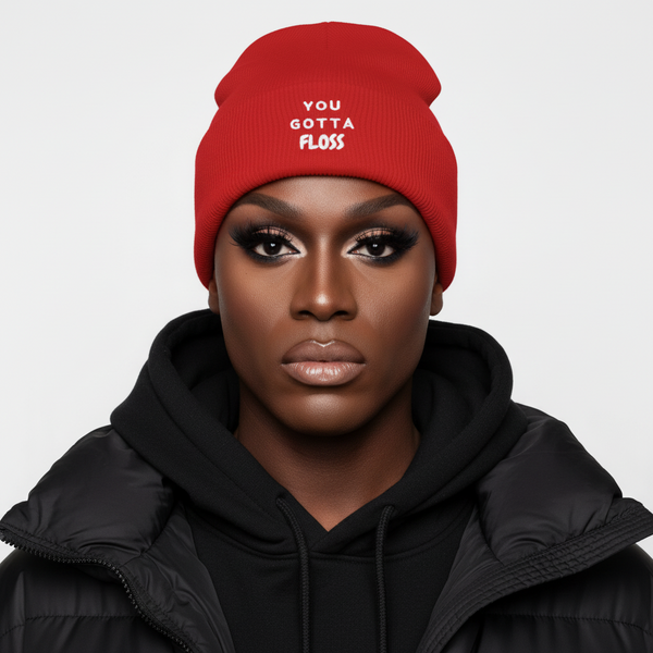 You Gotta Floss Cuffed Beanie, a bold unisex knit in black, worn with flawless makeup, black hoodie, puffer