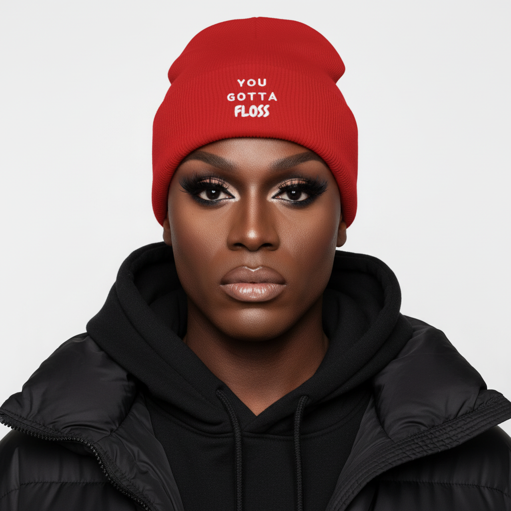 You Gotta Floss Cuffed Beanie, a bold unisex knit in black, worn with flawless makeup, black hoodie, puffer