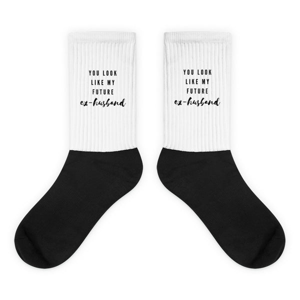 Pair of white-and-black crew socks reading “YOU LOOK LIKE MY FUTURE ex-husband”