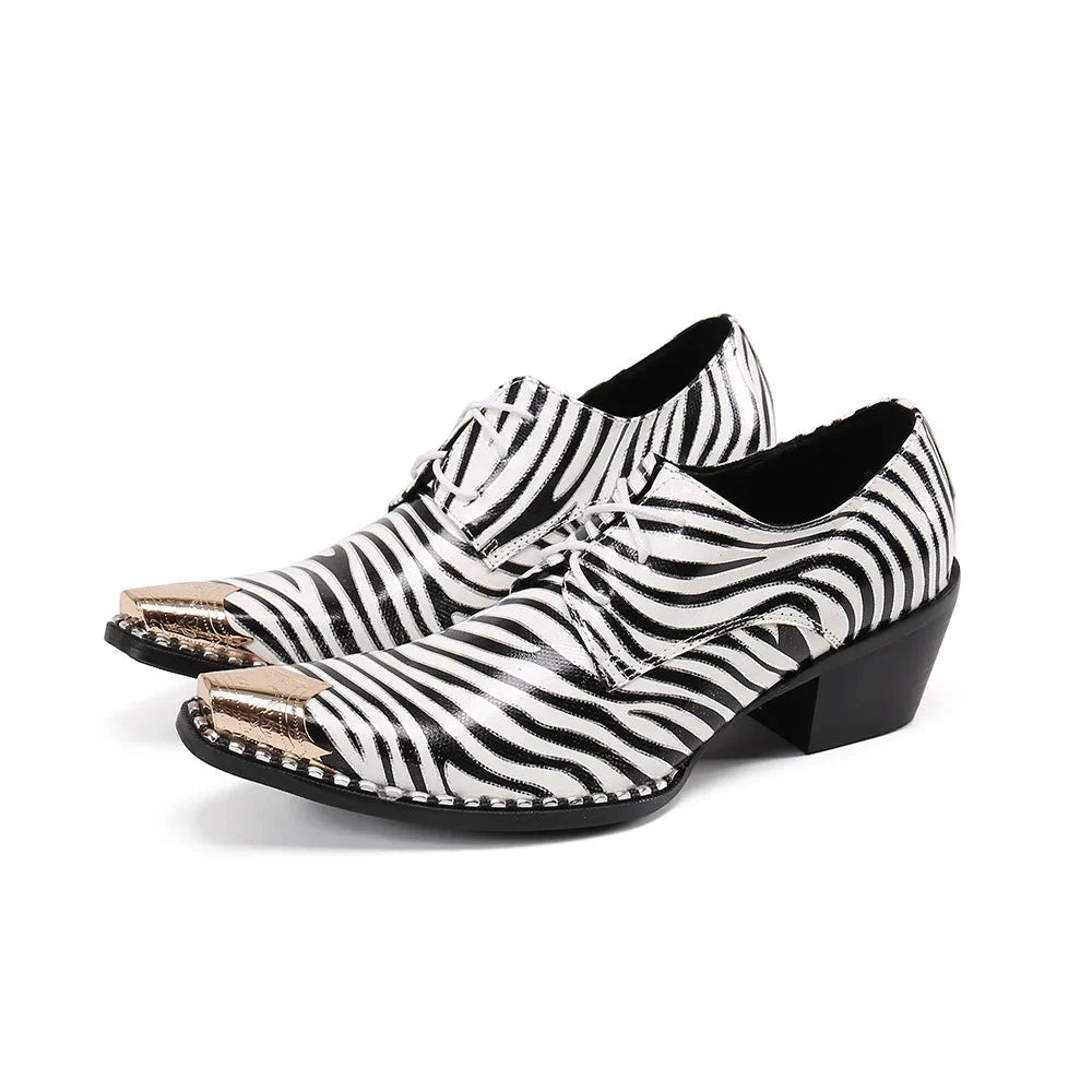 Pair of black-and-white zebra-striped lace-up shoes with metallic pointed toes