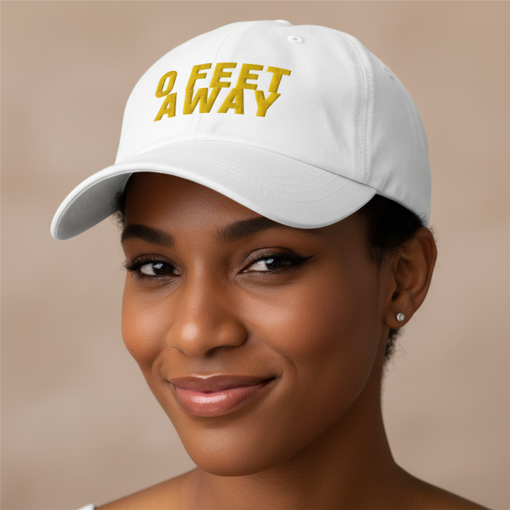 White embroidered Grindr cap with bright yellow "0 FEET AWAY" text