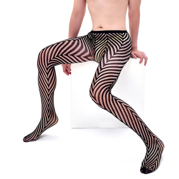 Model seated on a white block wearing black sheer pantyhose with bold zigzag stripes