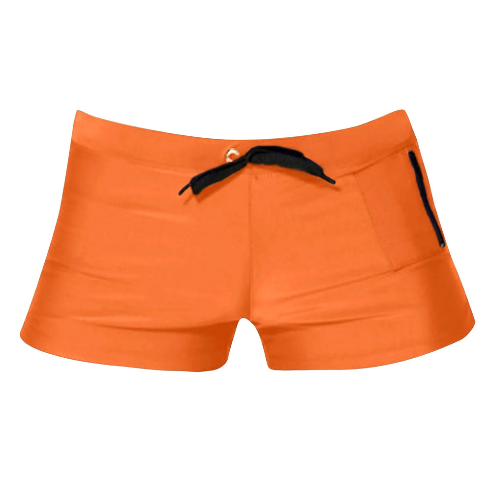 Front view of bright orange swim shorts with a black drawstring and side zip pocket