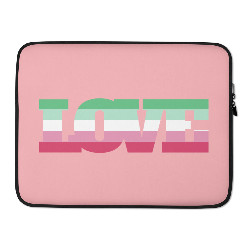 Front view of a pink laptop sleeve with a large multicolor abstract block design