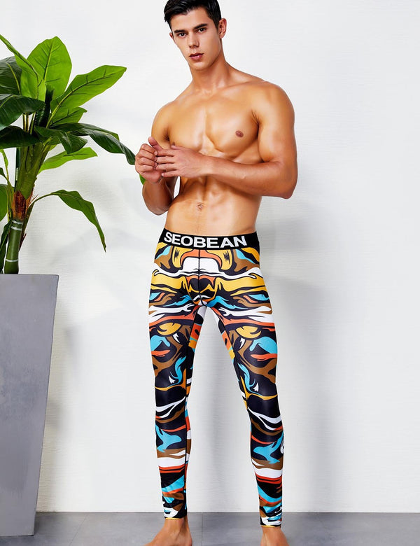 Colorful abstract-print leggings worn by a model, with a black SEOBEAN waistband