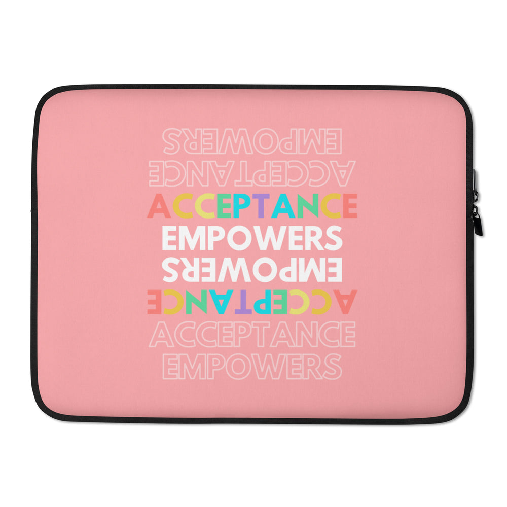 Pink laptop sleeve with colorful upside-down and upright “Acceptance Empowers” lettering