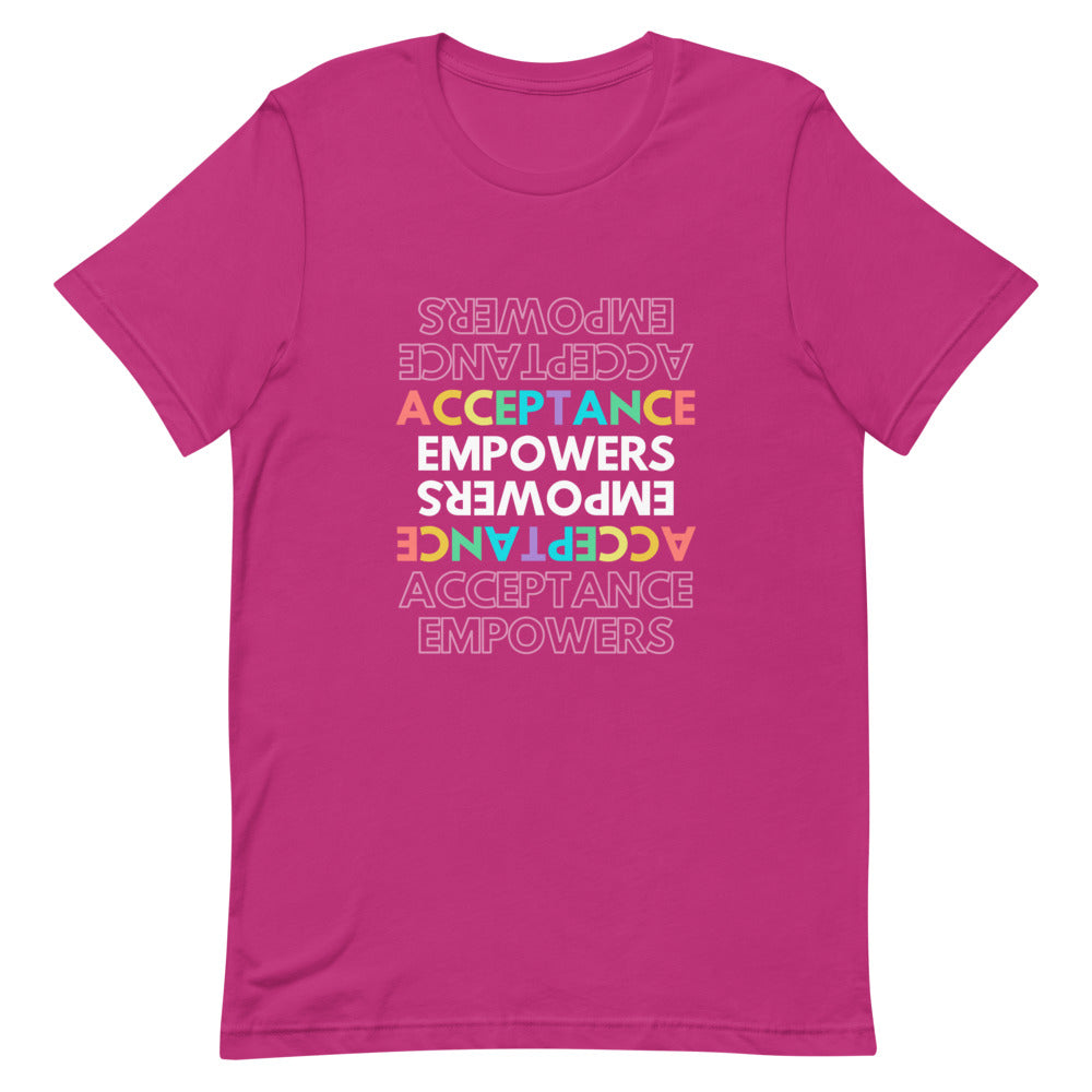 Pink T-shirt with colorful repeated “ACCEPTANCE EMPOWERS” text design