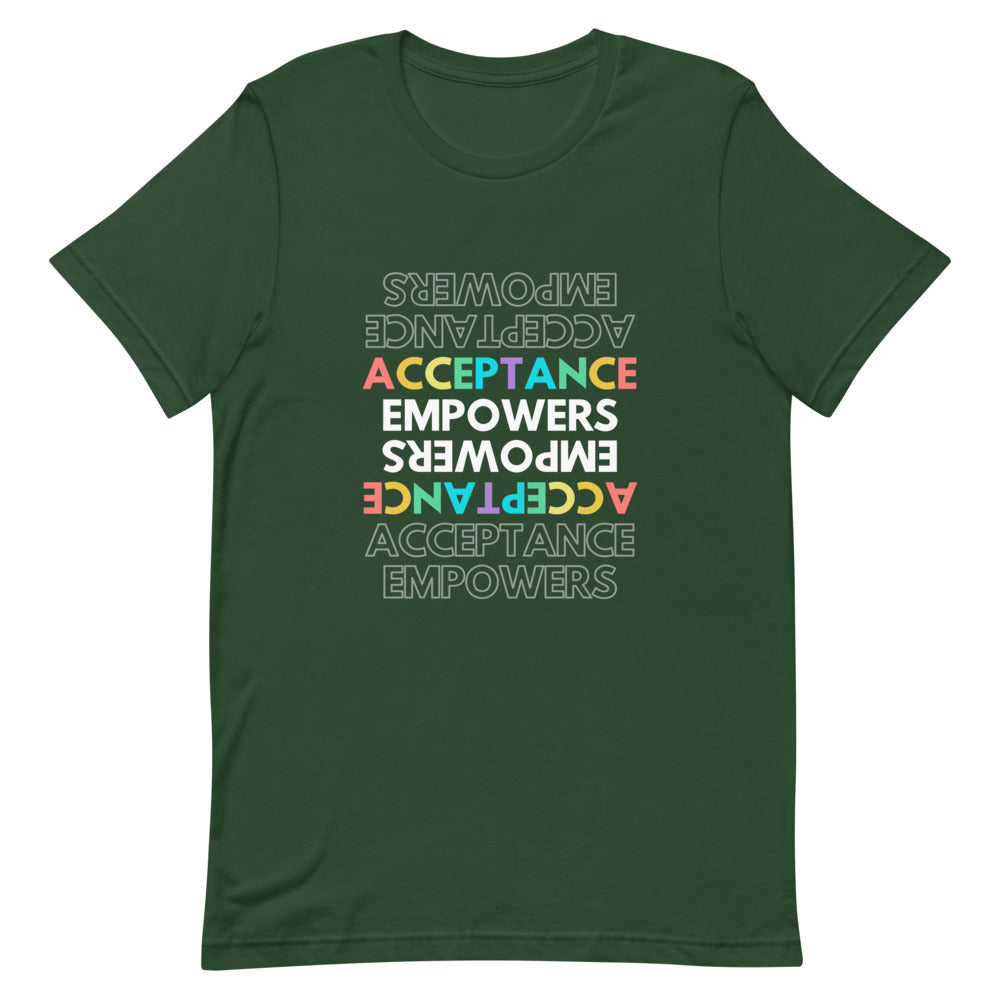 Close-up of a dark green T-shirt with rainbow “ACCEPTANCE EMPOWERS” text