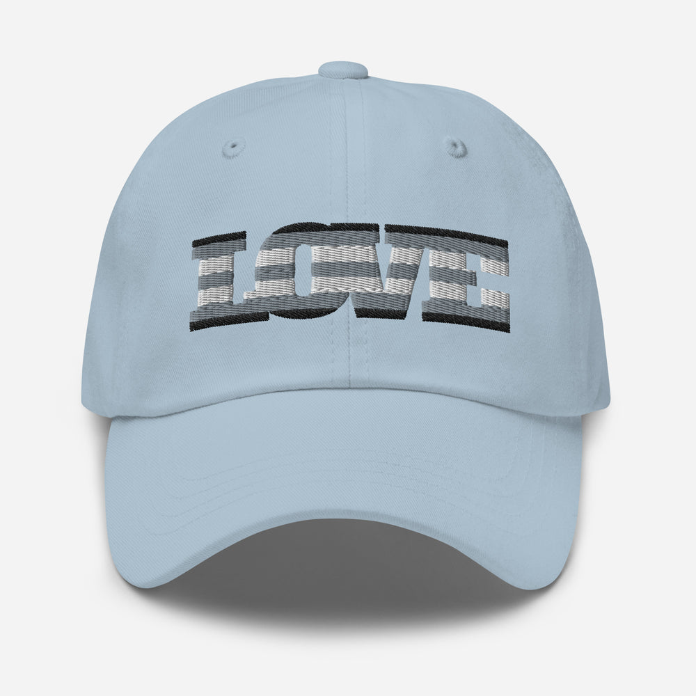 Front view of a light blue baseball cap embroidered with the word “LOVE”