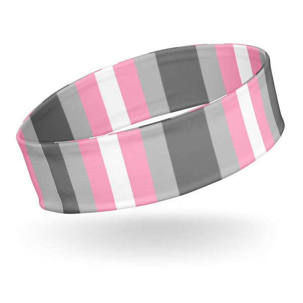 Close-up of a wide gray, pink, and white striped headband shown at an angle